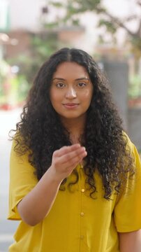 Indian Girl with Curly Hair Doing Adab