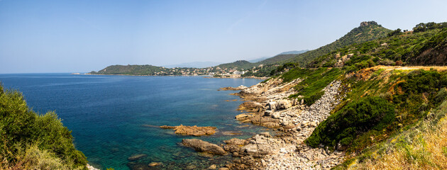 Panoramic view of rocky coastline and coastal village, Corsica, 13 June 2025