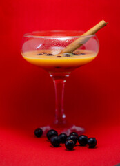 glass of liqueur with berries