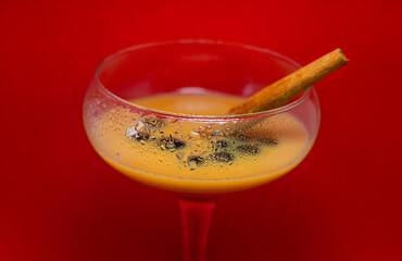 glass of liqueur with berries