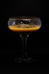 glass of liqueur with berries