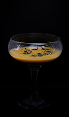 glass of liqueur with berries