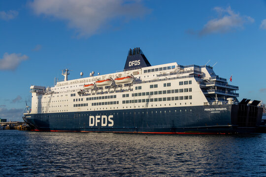 IJmuiden, Netherlands. 11-26-2024. The DFDS ferry "Princess Seaways" docked at IJmuiden harbor on a clear day, showcasing its large structure against a bright blue sky and calm waters.