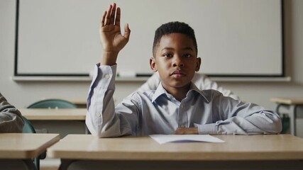 Student raising hand eagerly while listening during classroom lesson, showing academic enthusiasm and attentive learning posture with confident body language