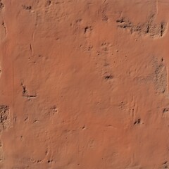 Fototapeta premium A rustic, weathered adobe wall texture showcasing subtle cracks and a warm brown hue, emphasizing its natural, earthy appearance ideal for architectural and design themes.