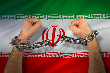 Men's hands breaking chains against the Iranian flag