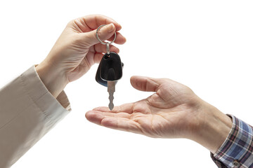 Woman's hand handing over car keys to a man's hand in a checkered shirt on isolated background....
