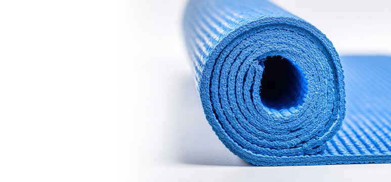 Blue yoga mat rolled and unrolled isolated on a transparent or white background

