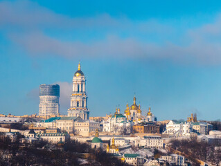 Beautiful skyline featuring historic churches and modern architecture in Kyiv during a clear winter...