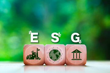 Wooden blocks with "ESG" letters and icons representing Environmental, Social, and Governance pillars, symbolizing sustainable and ethical business practices.