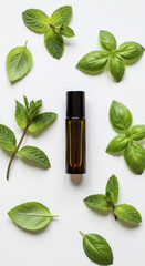 Essential Oil Roller Bottle Surrounded by Basil and Mint Leaves on White Background
