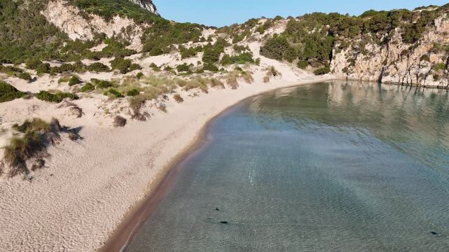 Aerial view of the hiking route from famous Voidokilia beach to the Nestor's Cave to Palai&oacute;kastro
 - the most famous beach in the Mediterranean with crystal clear waters in Messinia, Greece, 4k