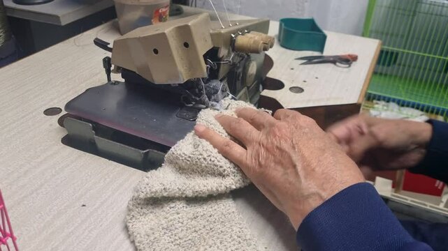 A close-up reveals an elderly man finishing a sock on a vintage sewing machine, reflecting the craftsmanship of 1950s working life