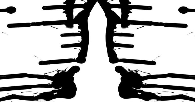 Slow motion of black paint drips and splatters on a white background that is mirrored to create a Rorschach image.