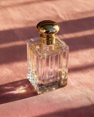 elegant glass perfume bottle with gold cap, luxury product shot