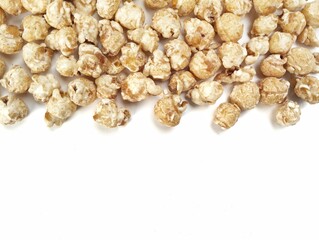 Pile of pop corn on white background with copy space 