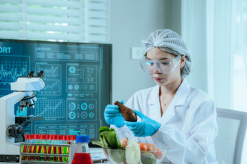 A food scientist conducts research and analysis in a laboratory, focusing on nutrition, safety, and...