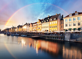 Copenhagen - Rainbow over Nyhavn canal at sunset, Denmark