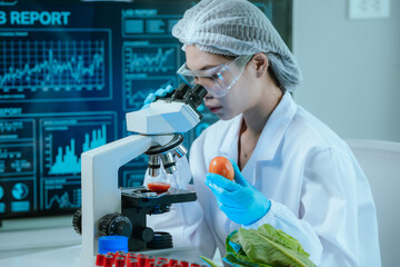 A food scientist conducts research and analysis in a laboratory, focusing on nutrition, safety, and...