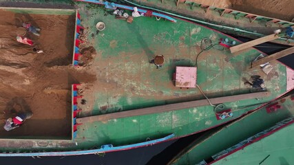 Dhaka, Bangladesh - 01 March 2025: Aerial view of cargo activities at river harbor, Bangladesh.