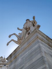 Obraz premium Rome, Italy - June 05, 2025, view from below on the Quirinale obelisk one of the thirteen ancient obelisks of Rome, located in Piazza del Quirinale, where it is part of the fountain of the Dioscuri.