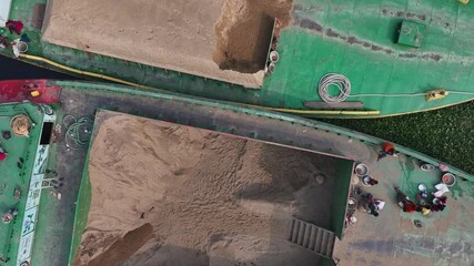 Dhaka, Bangladesh - 01 March 2025: Aerial view of traditional boats on a serene river, Bangladesh.
