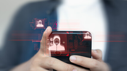Businessman holding smartphone with hacker alert, malware attack, and cybersecurity warning icons,...