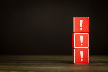 Three red blocks stacked vertically each block has a white exclamation mark. Symbol danger signal...