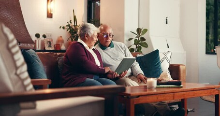 Tablet, relax and reading with old couple on sofa for bucket list vacation, retirement trip and research. Pensioner holiday guide, online booking and discussion with elderly man and woman in home - Powered by Adobe