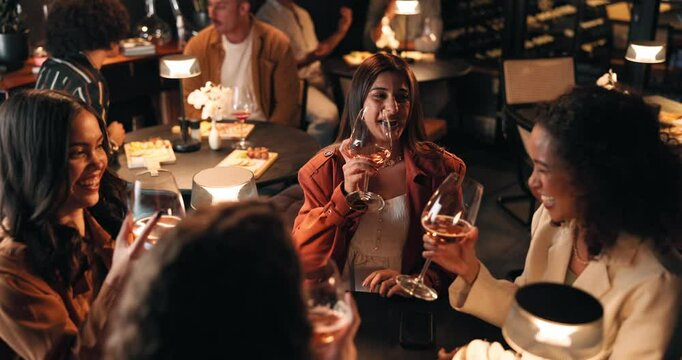 Girls night, laughing and toast with friends in restaurant for bonding, reunion or social gathering. Cheers, fine dining and wine with group of people at table together for evening catch up or drinks