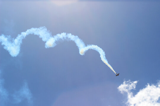 Biplane doing aerobatics in the distance