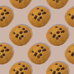 Pattern of delicious handmade chocolate cookies on mocha mousse background, flat lay