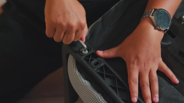 Hands Assembling Furniture with Tools