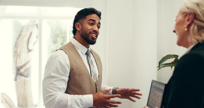 Hotel, hospitality and receptionist with guest at front desk for welcome, check in or reservation. Friendly service, woman and concierge with computer screen for room upgrade request or accommodation