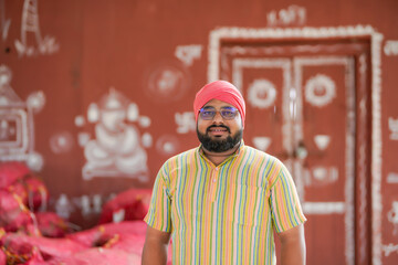 indian farmer standing confidently