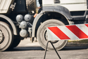 Heavy construction machines and truck outdoors for public street works.