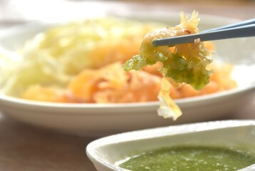 boiled jellyfish with slice cabbage on plate dipping Thai spicy and sour seafood sauce
