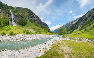 idyllic Stilluptal valley with Stillupbach stream and waterfall, spring landscape tyrol, austria