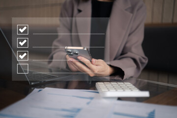 Businessman using smartphone to do online checklist survey, doing assessment online survey answer...