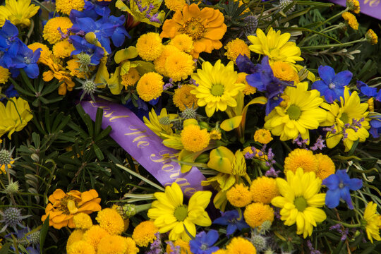 Lest we forget flower wreath laid beside a memorial