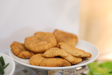 belyash plate with ready-made baked meat pies, plate with baked pies rotates in a circle.