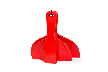 Red construction plastic spatula isolated on white background.