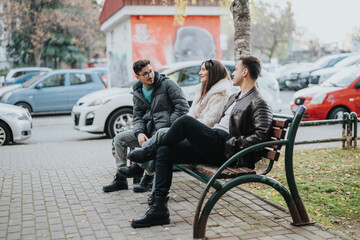 Three individuals are seated on a park bench, enjoying a relaxed conversation outdoors. The setting...