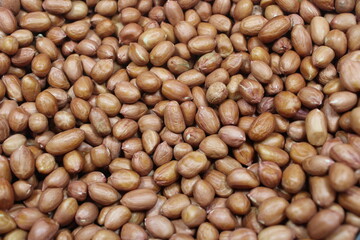 A full frame raw peanuts, showcasing their natural texture and light brown color, ideal for food backgrounds