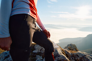 Determined Hiker Finds Peace at the Mountain Summit After a Challenging Climb.