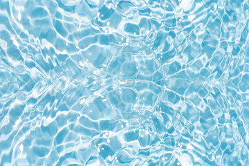 Blue water with ripples on the surface. Defocus blurred transparent blue colored clear calm water...