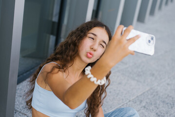 Teen Girl Taking A Selfie Outdoors