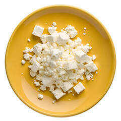 Feta cheese on a yellow plate isolated on transparent background with white texture and crumbly look
