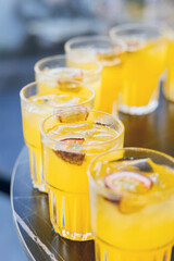 Refreshing passion fruit cocktails served on tray


