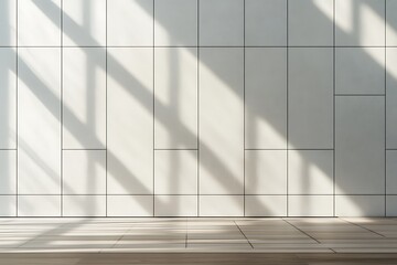 Obraz premium Modern white tiled wall with sunlight and shadows over wood flooring architectural detail